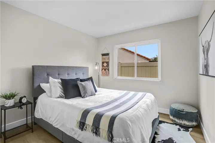 This additional bedroom is comfortable and move-in ready, with updated flooring, neutral paint, and a cozy feel.