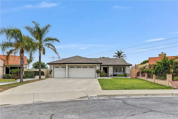 Welcome to 2869 W. Esperanza Drive, a charming single-story home with great curb appeal, a wide driveway, and a three-car garage.