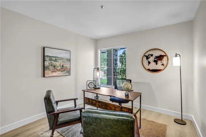 This versatile bedroom is staged as a home office, perfect for working from home, studying, or creating a quiet retreat.