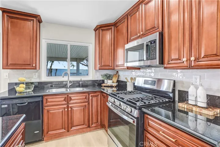 The open kitchen and family room create a comfortable space for cooking, visiting, and spending time together.