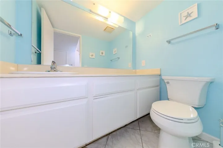 Downstairs bathroom with ample cabinent storage.