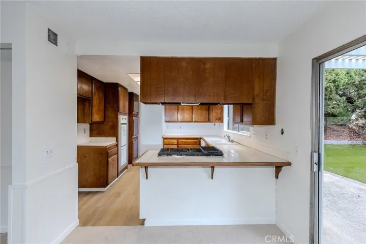Two options for a dining room setup, plus a breakfast bar.