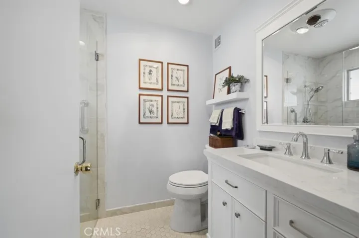 Primary bath, with level to floor walk in large shower