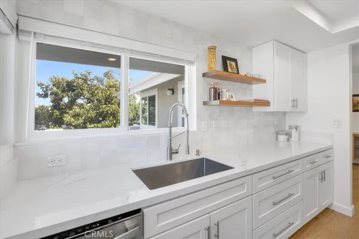 Kitchen with beautiful window overlooking your patio