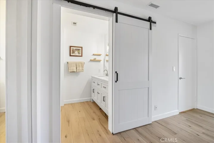 Barn doors open to your master suite bathroom