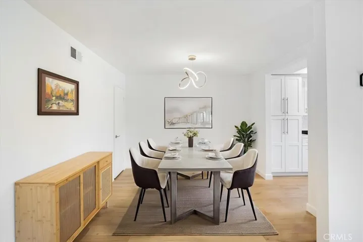 Dining room open to kitchen and living room-digitally staged