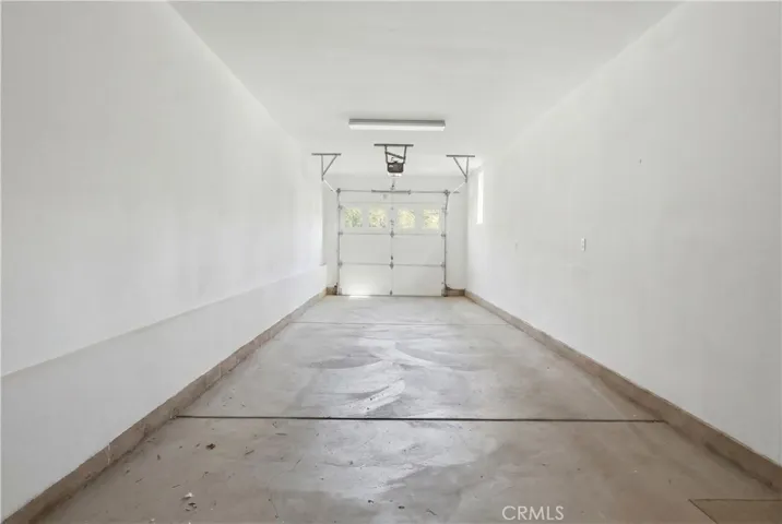 Garage photo has been AI-enhanced to remove personal items and present a cleaner view of the space.
