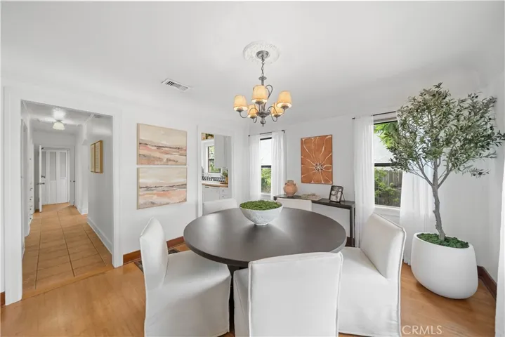 Dining room connects to the hallway (on the left) and to the kitchen (doorway on the right).