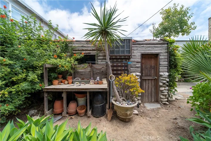 Potting rack is located next to one of the garage entrances.
