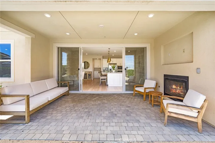 California room with fireplace, LED lighting and TV ready niche