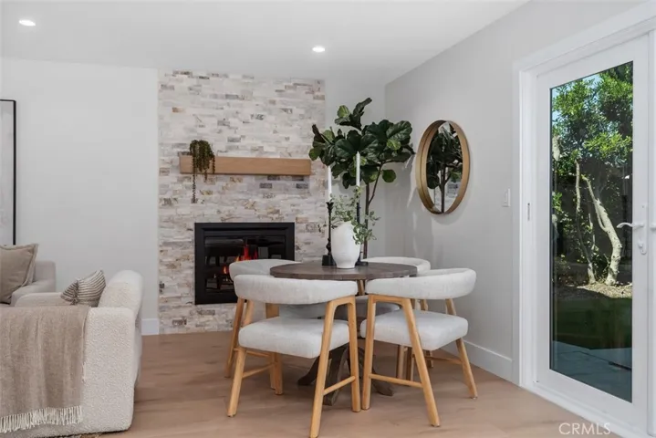 Family Room with gas or wood burning stone fireplace and cozy informal dining area~
