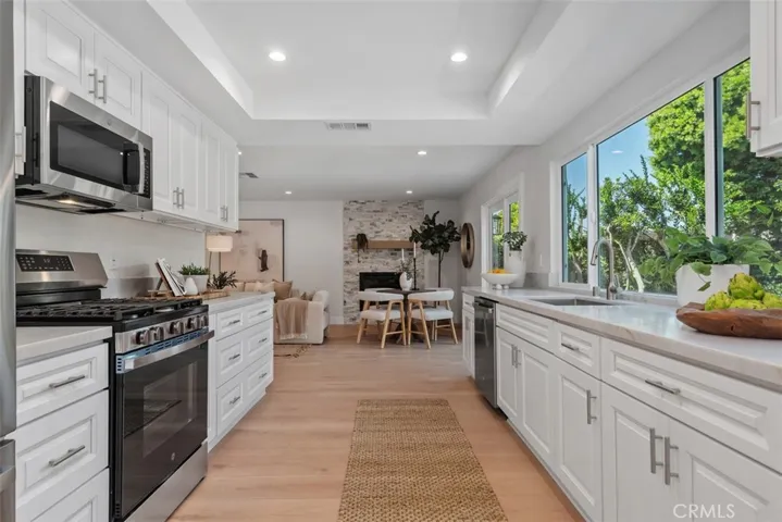 New white shaker cabinetry, quartz countertops, stainless steel appliances...a chef's delight!