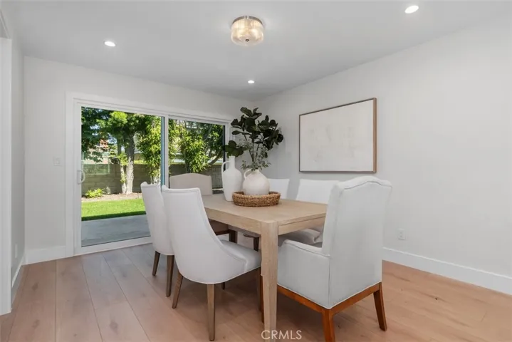 Dining Room with a view of the lush green backyard