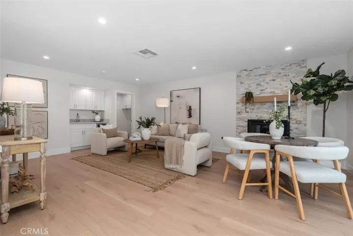 The Family Room includes a built-in wet bar with quartz countertop, stainless steel sink and wine/beverage cooler!