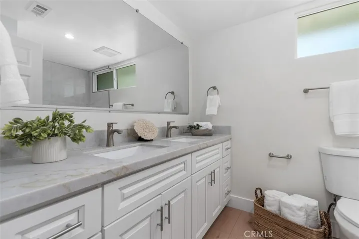 Upstairs Hall Full Bath with dual sinks~