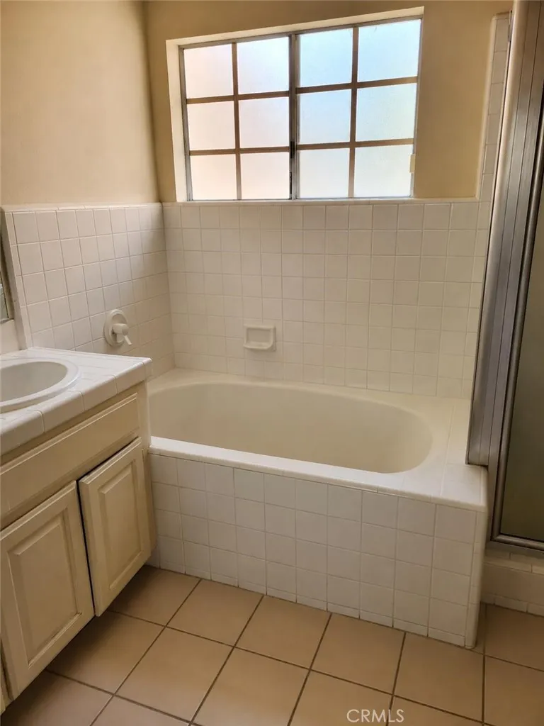master bath upstairs,AI-Enhanced Photo: This image has been digitally enhanced using AI technology for marketing purposes. An original, unedited photo is provided for comparison. The enhancement does not represent any structural changes to the property.
