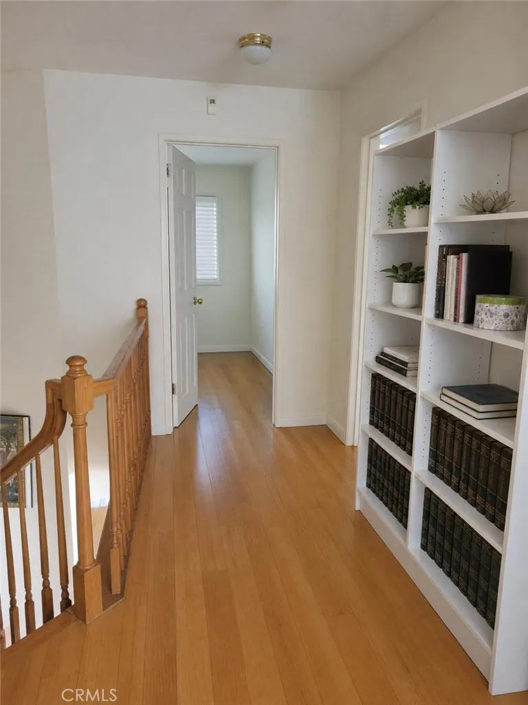 hallway upstairs,AI-Enhanced Photo: This image has been digitally enhanced using AI technology for marketing purposes. An original, unedited photo is provided for comparison. The enhancement does not represent any structural changes to the property.
