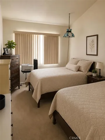 Bedroom #2 upstairs AI-Enhanced Photo: This image has been digitally enhanced using AI technology for marketing purposes. An original, unedited photo is provided for comparison. The enhancement does not represent any structural changes to the property.
