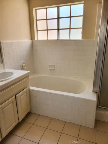 master bath upstairs,AI-Enhanced Photo: This image has been digitally enhanced using AI technology for marketing purposes. An original, unedited photo is provided for comparison. The enhancement does not represent any structural changes to the property.
