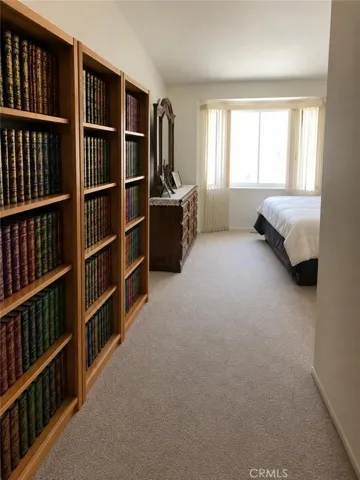 master bedroom upstairs,AI-Enhanced Photo: This image has been digitally enhanced using AI technology for marketing purposes. An original, unedited photo is provided for comparison. The enhancement does not represent any structural changes to the property.
