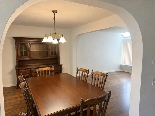 formal dining area,AI-Enhanced Photo: This image has been digitally enhanced using AI technology for marketing purposes. An original, unedited photo is provided for comparison. The enhancement does not represent any structural changes to the property.
