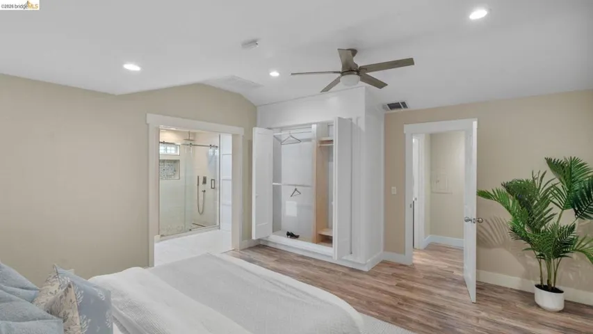 Bedroom featuring wood-finish flooring, recessed lighting, and a ceiling fan