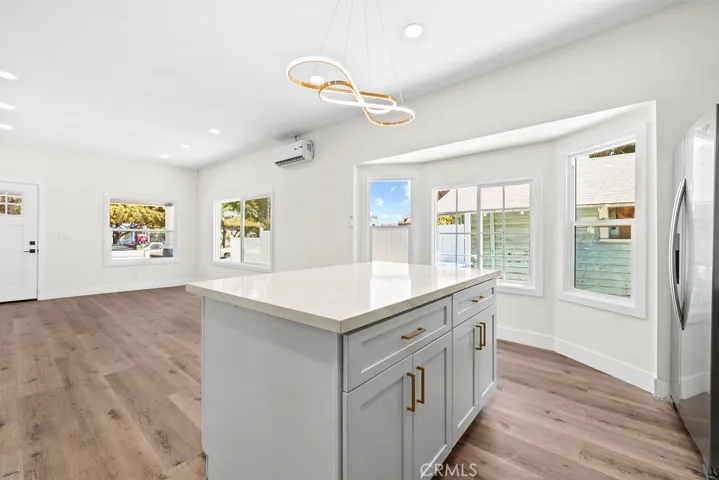 Large kitchen island overlooking the open living area, creating ideal flow for entertaining.
