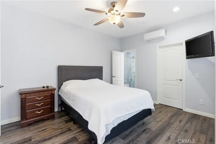 248 square foot permitted addition to the home includes a spacious downstairs bedroom with ensuite bathroom and private entrance.