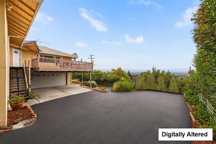 Photo shows repaved driveway.