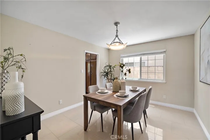The home also features a separate formal dining room and an inviting family room with a wet bar that opens to the upgraded kitchen