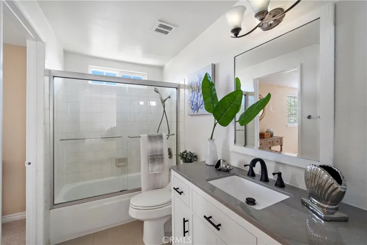 while the two upstairs secondary bedrooms share a convenient Jack-and-Jill bathroom.