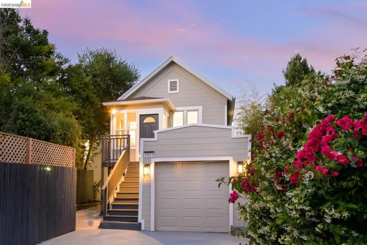 Light gray siding exterior with a prominent attached garage