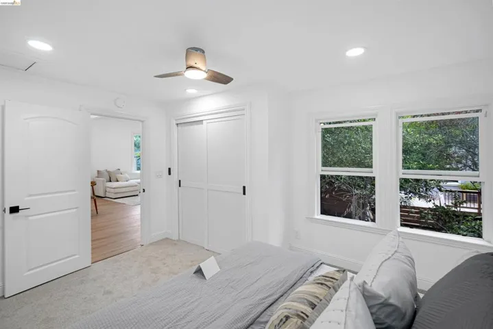 Room featuring white walls, recessed lighting, and a ceiling fan with integrated illumination