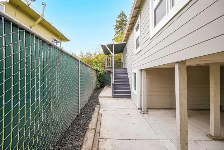 Exterior siding with white trim around windows