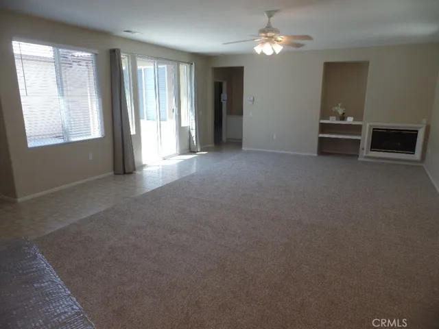 Living room with Fireplace & lots of natural light