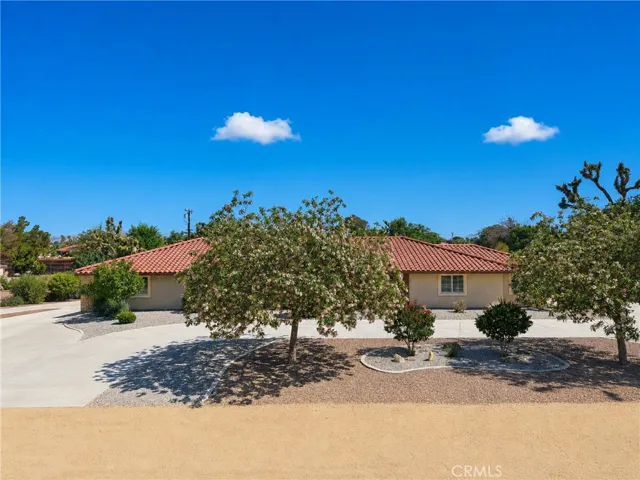 Front of House with large trees