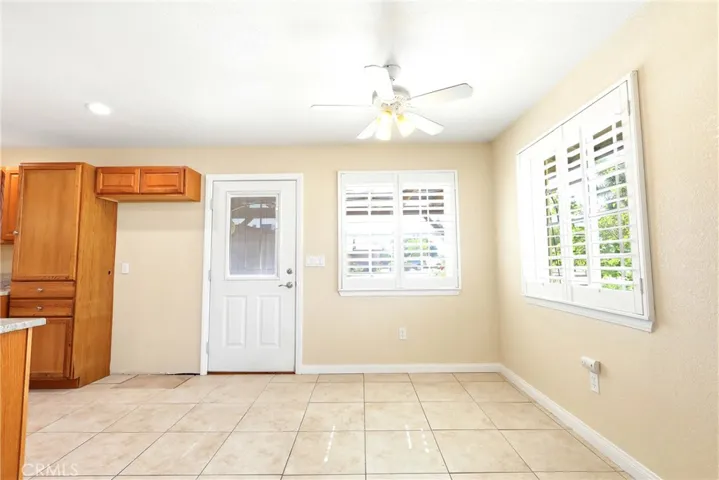 Kitchen/Dining in Attached Separate Dwelling.  Exterior door to Garage.