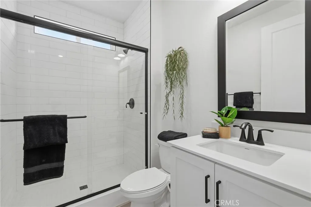 Convenient full bathroom serving the main-level bedroom and guests.