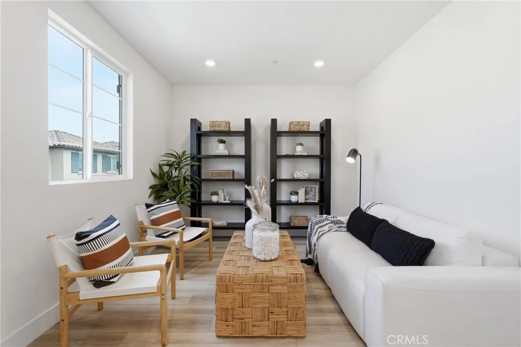 Flexible upstairs living area ideal for a media room, home office, gym, study space, or lounge.