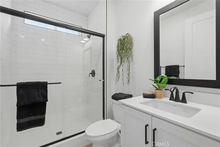 Convenient full bathroom serving the main-level bedroom and guests.
