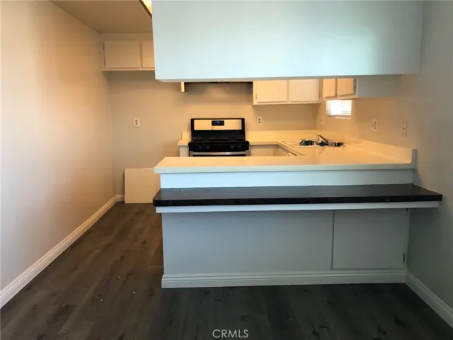 Unit #4 eating bar looking at kitchen view