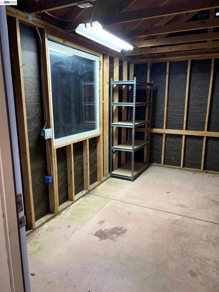 Outside measurements of shed 10.5 feet x 14 feet, inside has electrical and concrete flooring.  Has built in wood shelves for storage but could be removed for more open space.  Walls can easily be finished to make this area into an office