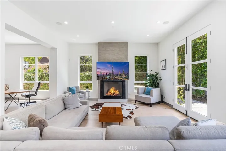 Walls of glass, comfy seating and a fireplace