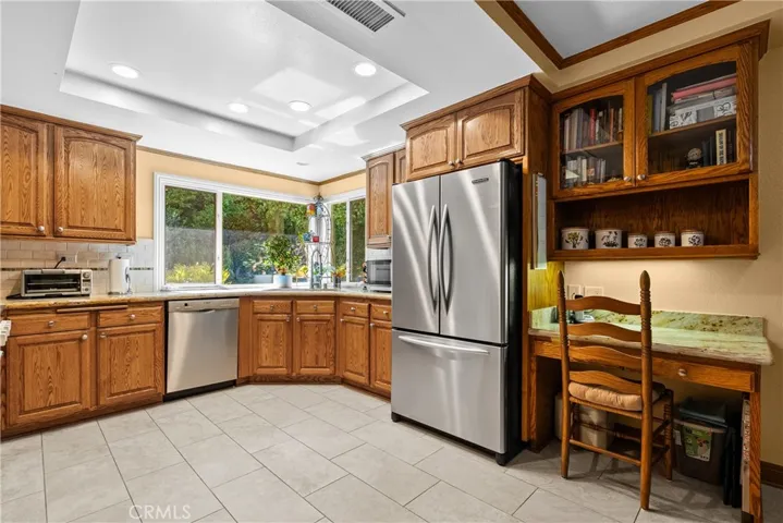 Kitchen overlooks the private backyard.