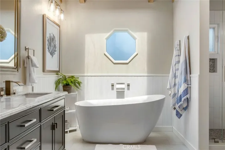 Freestanding soaking tub in primary bath