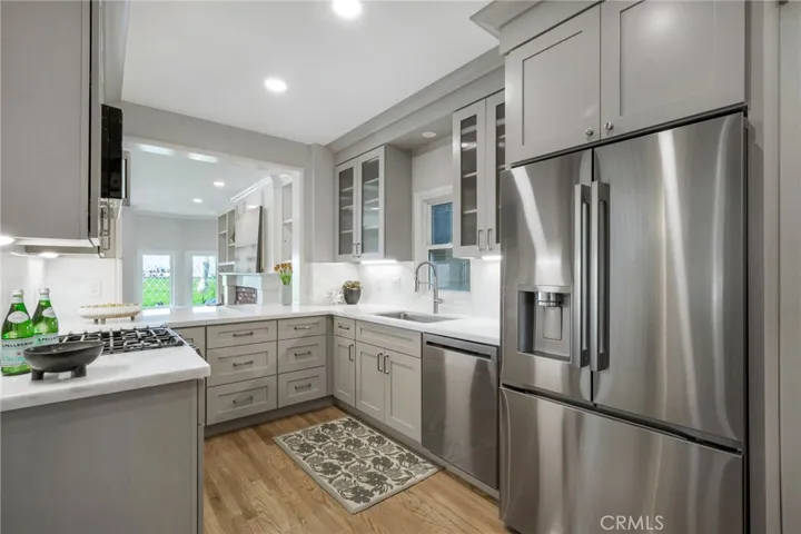 Newly remodeled kitchen with stainless steel appliances, overlooking the living room and ocean views
