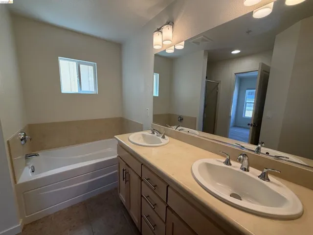 Double vanity with individual sinks and chrome fixtures