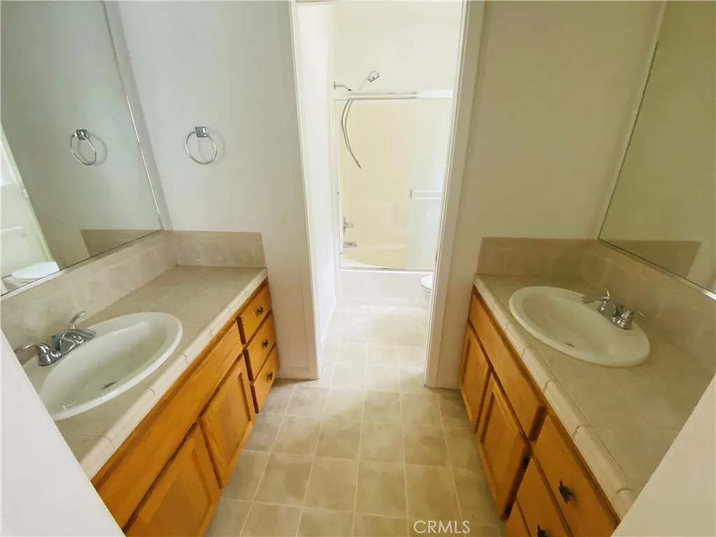 Dual vanities in primary bathroom.