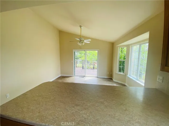Breakfast nook with slider to back deck.