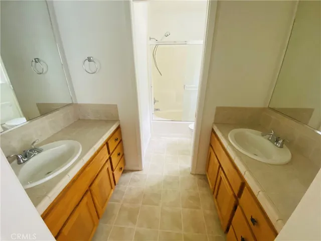 Dual vanities in primary bathroom.